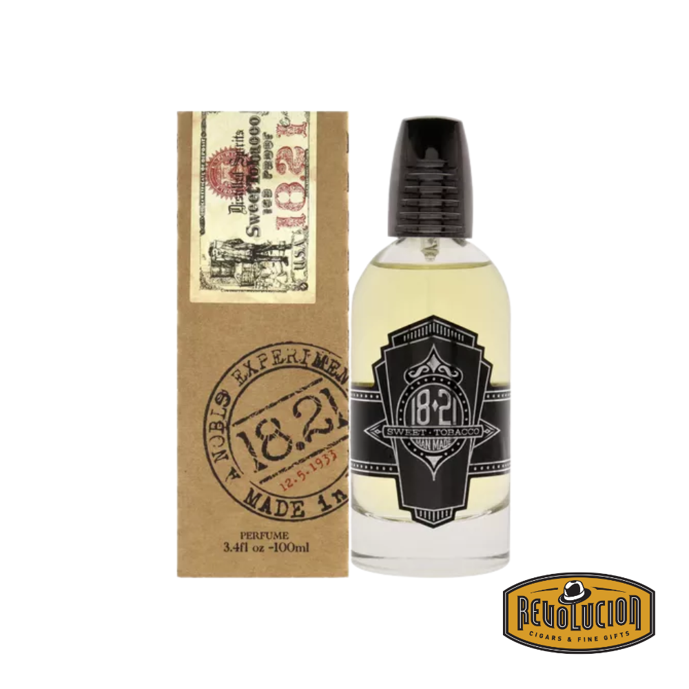 18.21 Man Made Sweet Tobacco Spirits Parfum bottle alongside its elegantly crafted box, embodying classic sophistication.