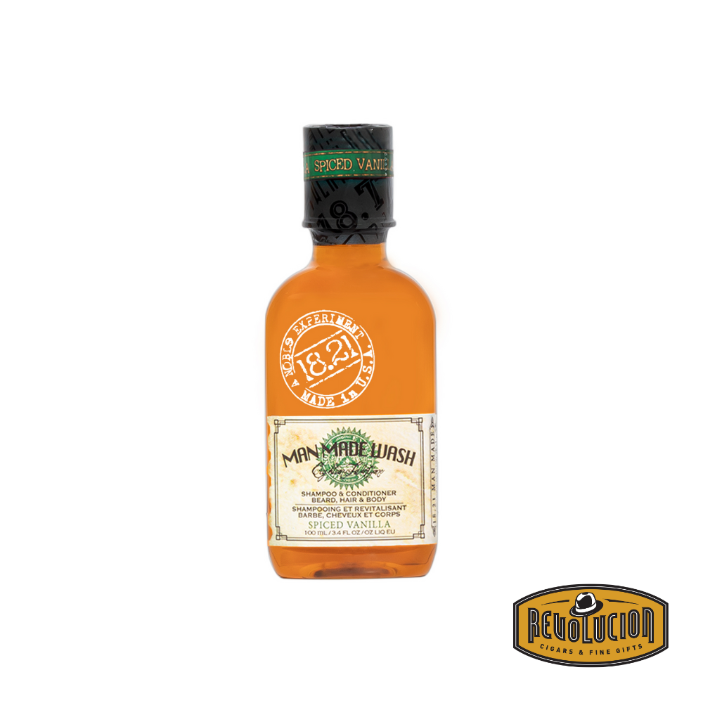 Front view of the 18.21 Man Made Wash Shampoo & Conditioner in Spiced Vanilla scent, 3.4oz travel-size bottle with vintage apothecary-style design and elegant brown label.