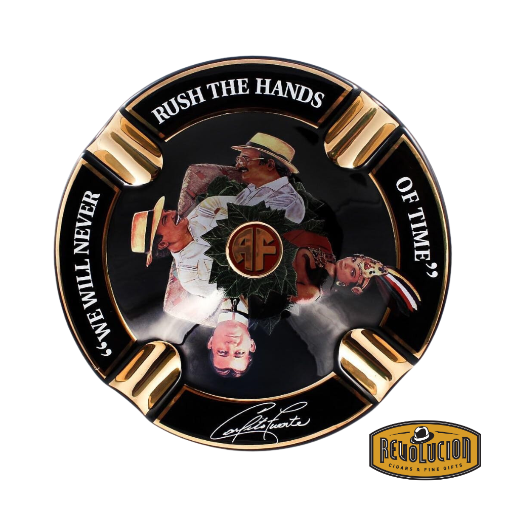 Arturo Fuente 'Journey Through Time' Ashtray in Black, featuring a vibrant design with four gold cigar grooves and iconic Arturo Fuente artwork, displayed with the Revolucion Cigars & Fine Gifts logo.