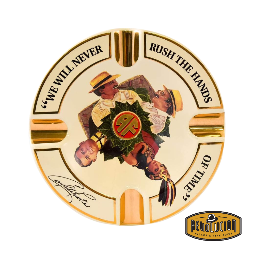 Arturo Fuente 'Journey Through Time' Ashtray in Cream, featuring a vibrant design with four gold cigar grooves and iconic Arturo Fuente artwork, displayed with the Revolucion Cigars & Fine Gifts logo.