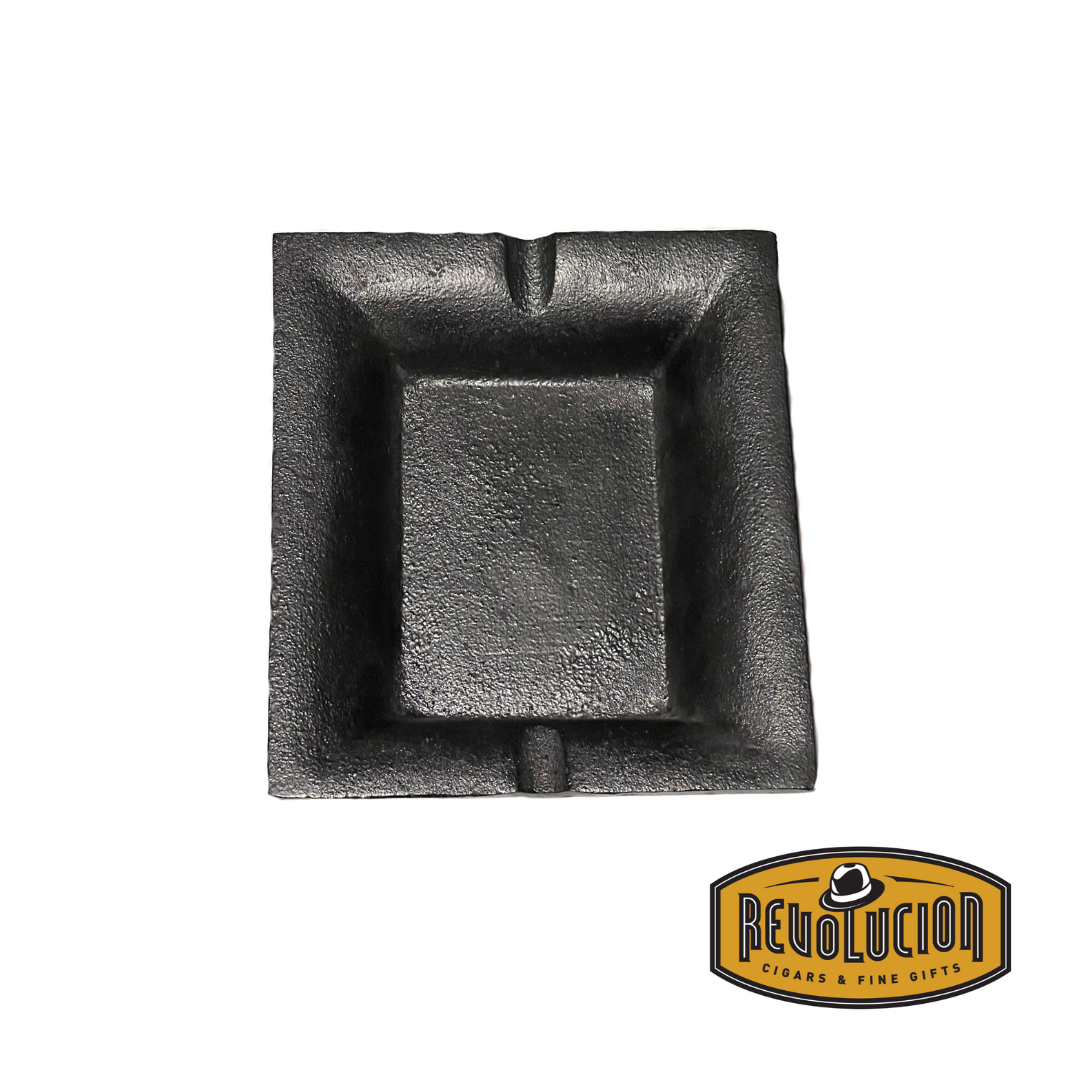 A durable cast iron ashtray with a classic design, featuring a deep bowl and designated cigar rests for convenience.