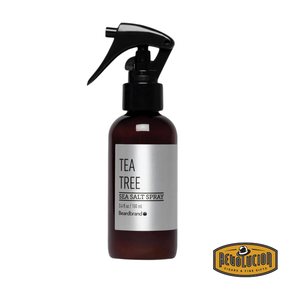 A bottle of Beardbrand Seasalt Spray in the refreshing Tea Tree scent, designed to add volume, texture, and a light hold to hair and beard.