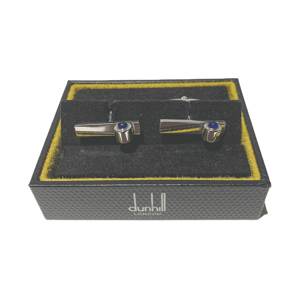 Elegant Blue Ruby Dunhill cufflinks featuring deep blue gemstones set in a polished metal frame, viewed from the front to highlight their refined craftsmanship.