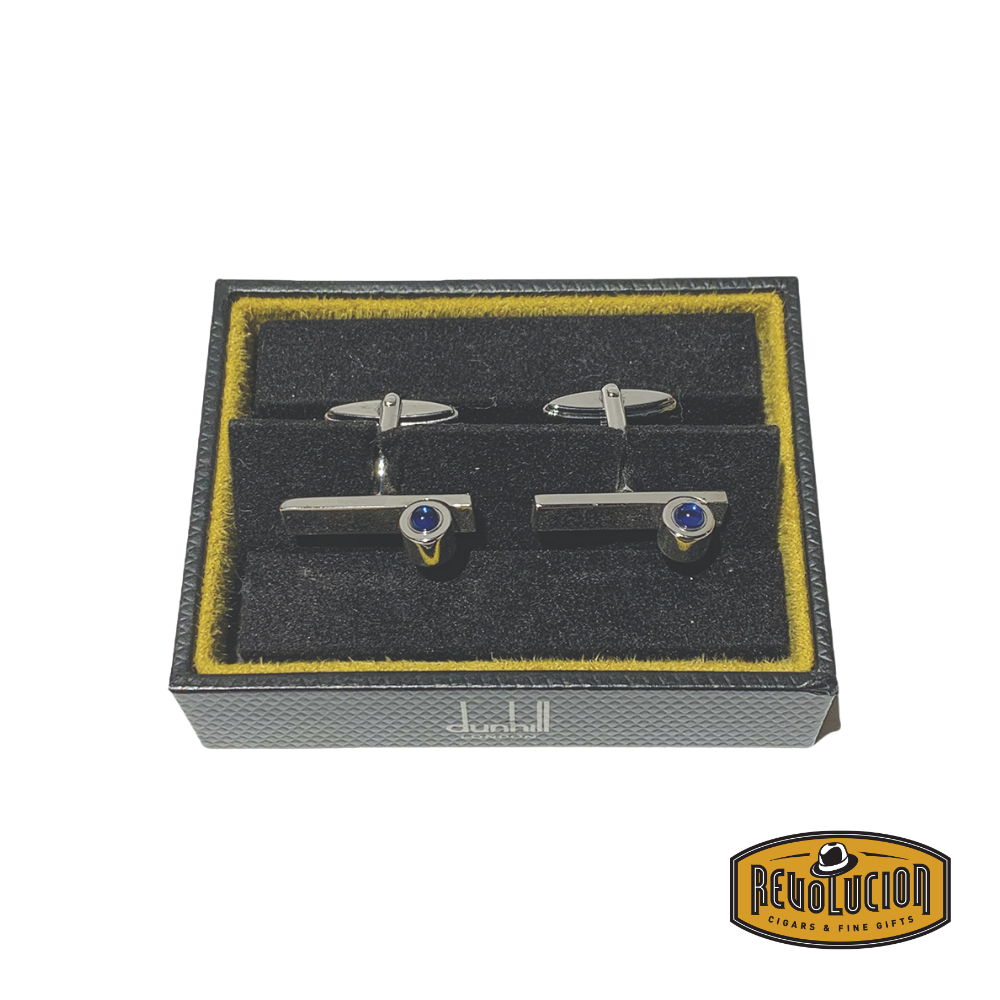 Stylish Blue Ruby Dunhill cufflinks captured from a top view, showcasing the intricate detailing and luxurious blue gemstones embedded in a sleek metallic finish.