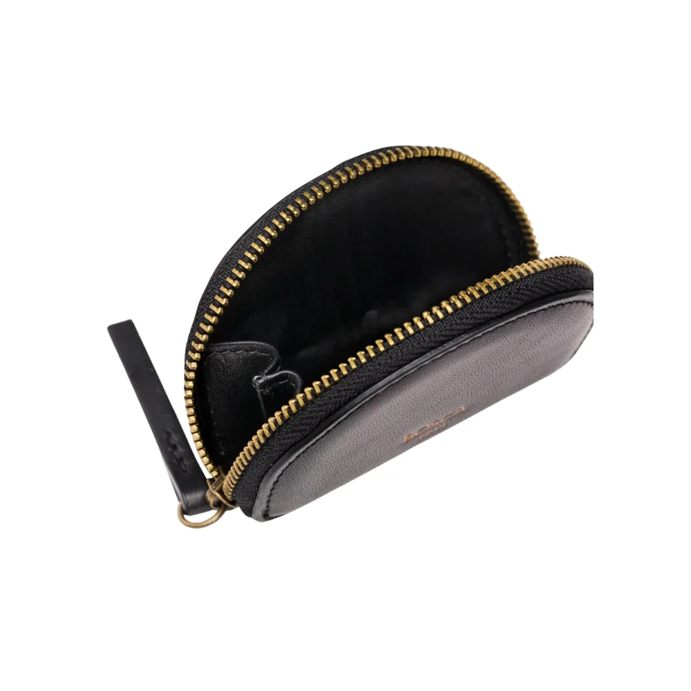 Opened Bosca Unisex Zipper Leather Coin Purse, revealing a spacious interior ideal for organizing coins, keys, and other small items.