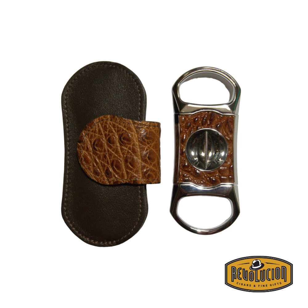 Brizard & Co. "V" Cigar Cutter - Genuine Caiman Cognac leather finish next to its elegant leather case, showcasing exotic texture and a precise V-cut blade.