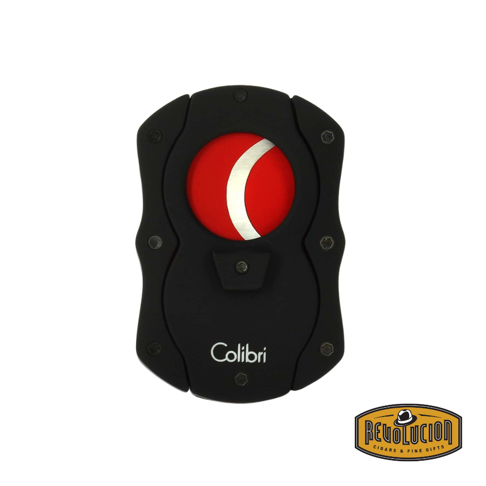 Closed Colibri cigar cutter in black and red with stainless steel blades, displayed against a white background with Revolucion logo.