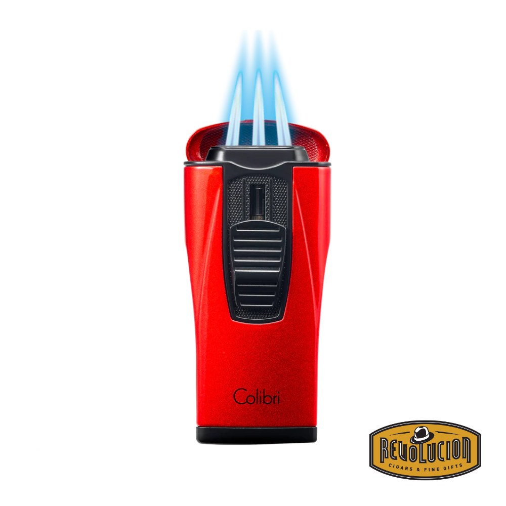 The Colibri Monaco Triple Jet Cigar Lighter in Metallic Red igniting its powerful triple jet flames, ideal for an even and efficient cigar burn.