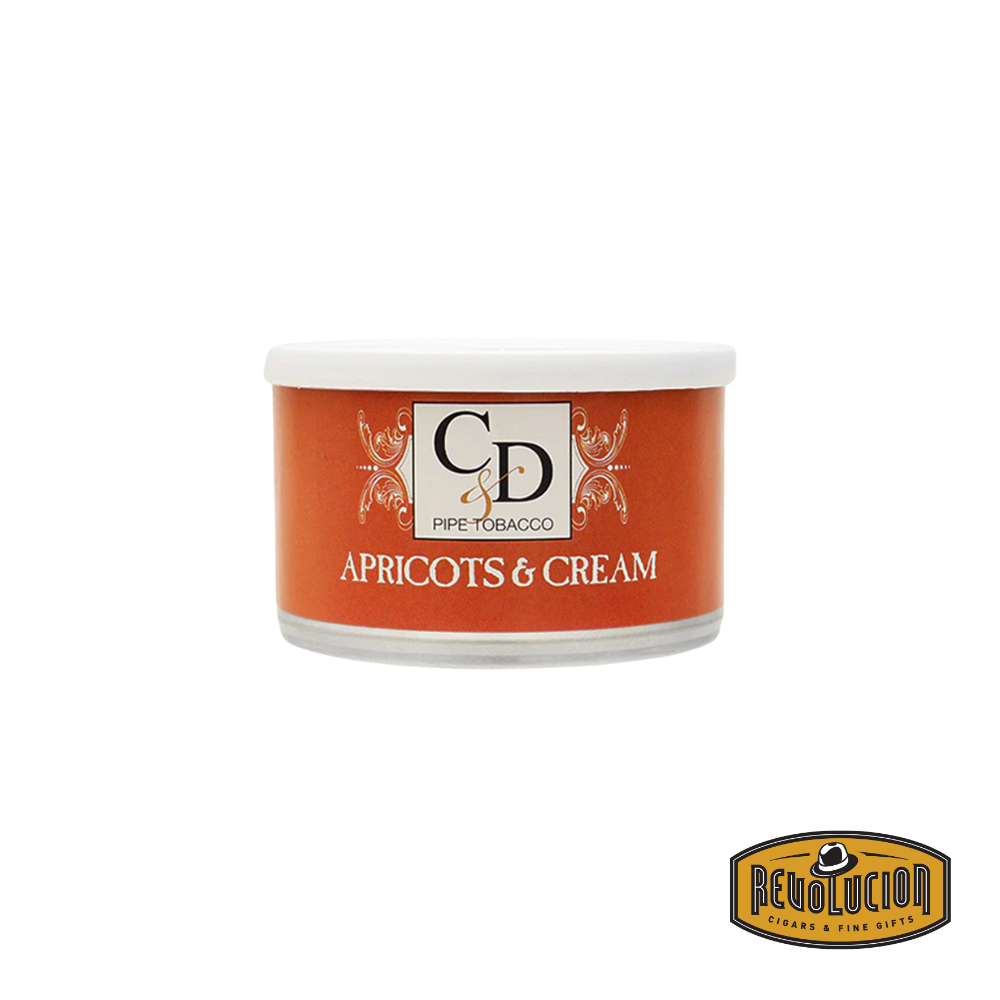 Original artwork of Cornell & Diehl Apricots & Cream pipe tobacco tin. The label displays a soft, creamy color scheme with imagery that reflects the smooth and fruity character of this aromatic blend. The “Revolución” logo is placed in the corner.