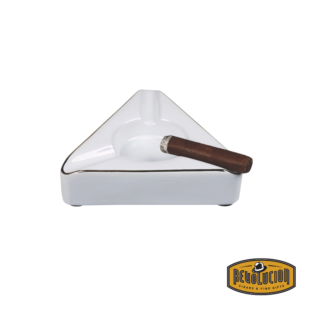 Craftsman's Bench Trident Ashtray with a cigar resting in one of its grooves, showcasing its functionality and elegant style.