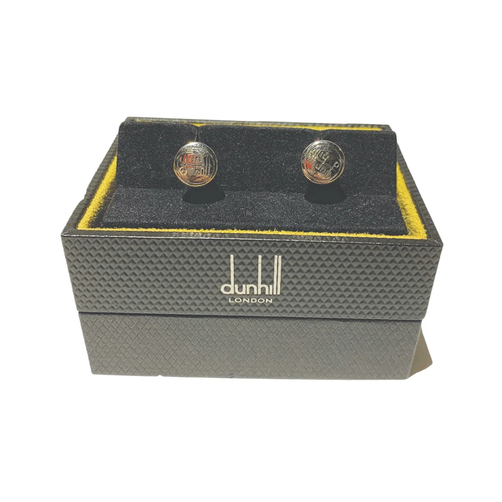 Front view of Dunhill cufflinks with the Dunhill logo, emphasizing their sophisticated appeal and luxurious detailing