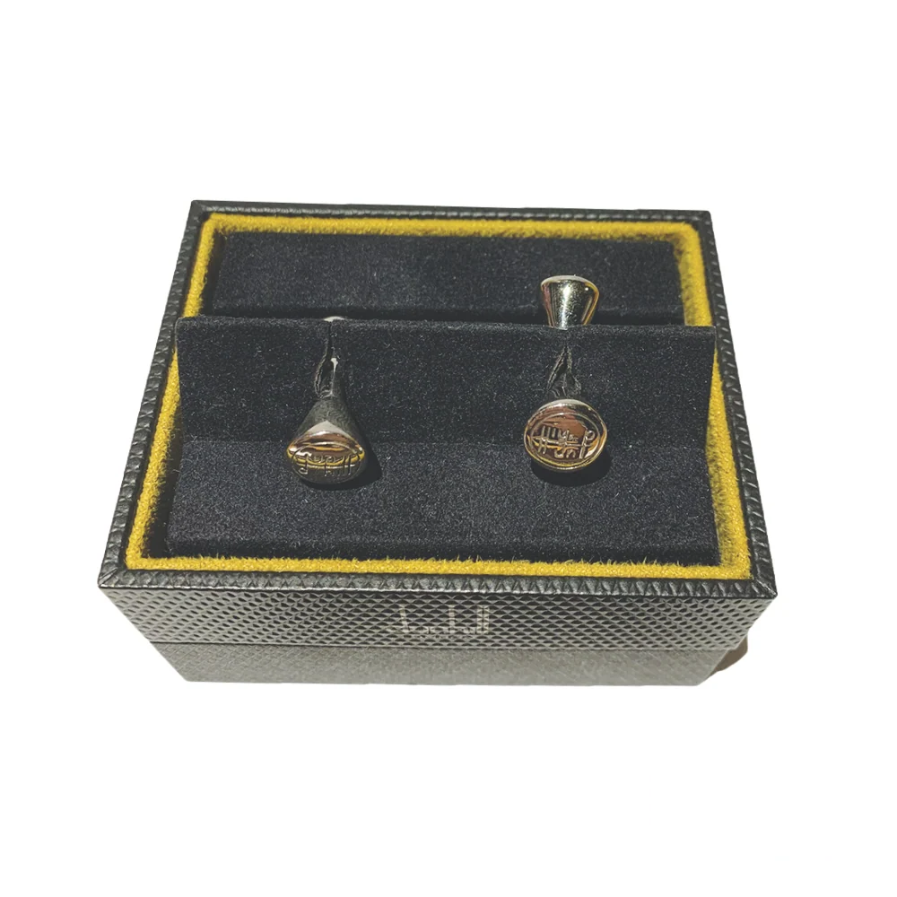 Top view of Dunhill Logo cufflinks, showcasing their elegant design and refined craftsmanship with a sleek and modern aesthetic.