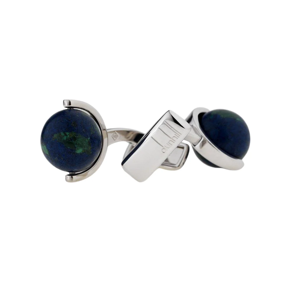 Dunhill Earth cufflinks featuring deep blue spherical stones with green natural patterns, set in a polished silver frame with the Dunhill logo engraved.
