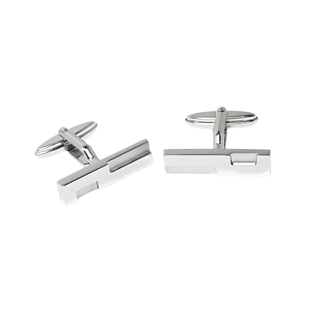 Dunhill cufflinks with a sleek silver finish, featuring a minimalist rectangular design with the brand’s signature “D” logo engraving.