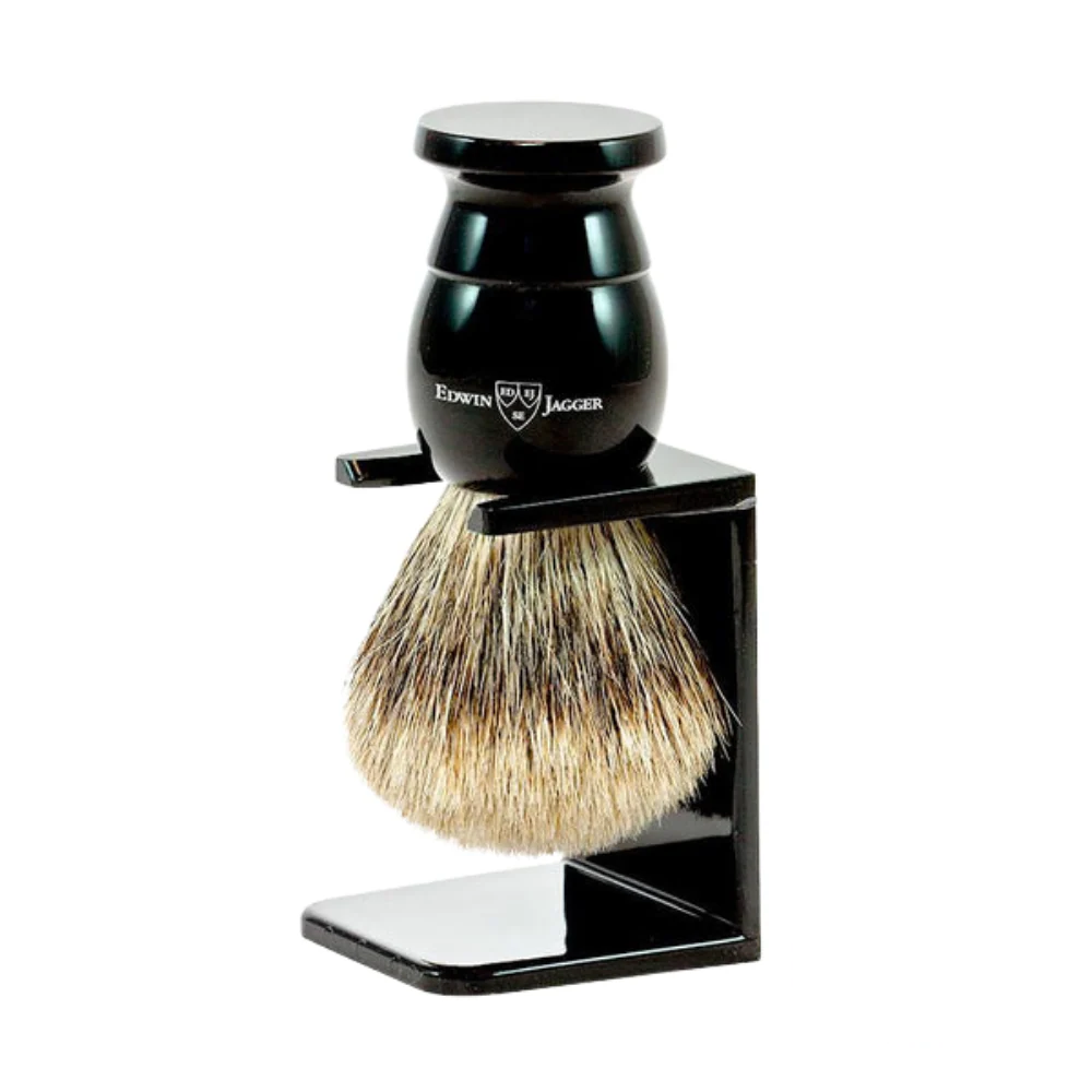 Edwin Jagger large ebony drip stand holding a shaving brush for display.