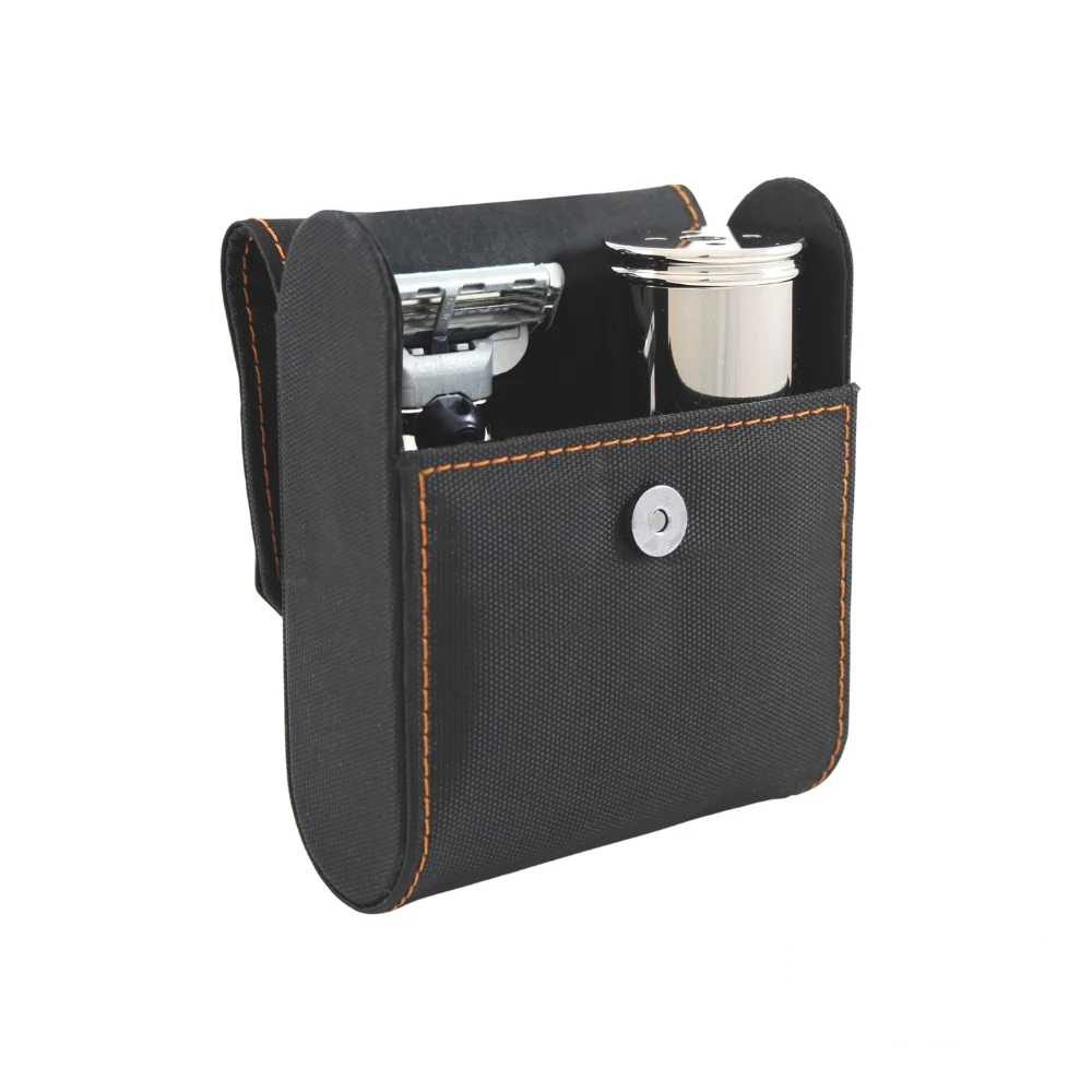 Opened leather case showing the Edwin Jagger Mach3 razor and accessories neatly organized inside.