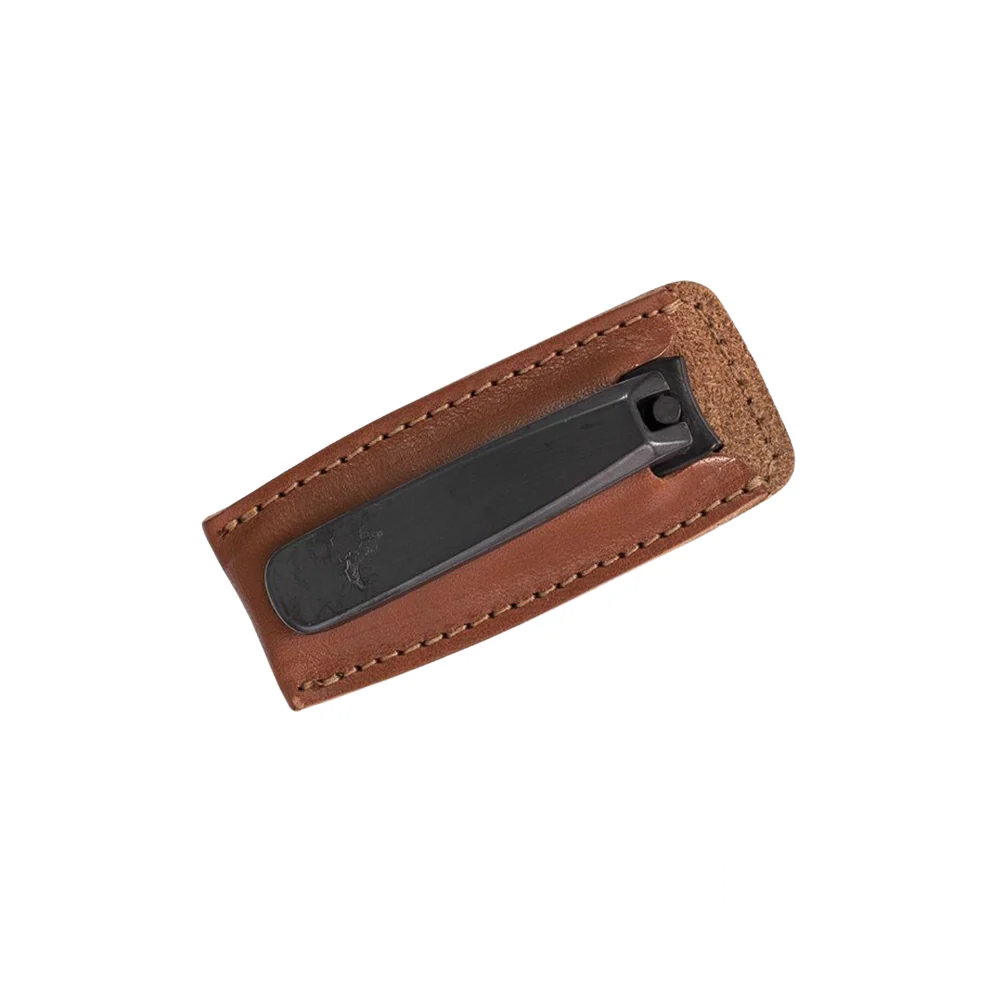 Executive toe nail clipper with a sleek black finish, securely stored in a premium brown leather case with detailed stitching.