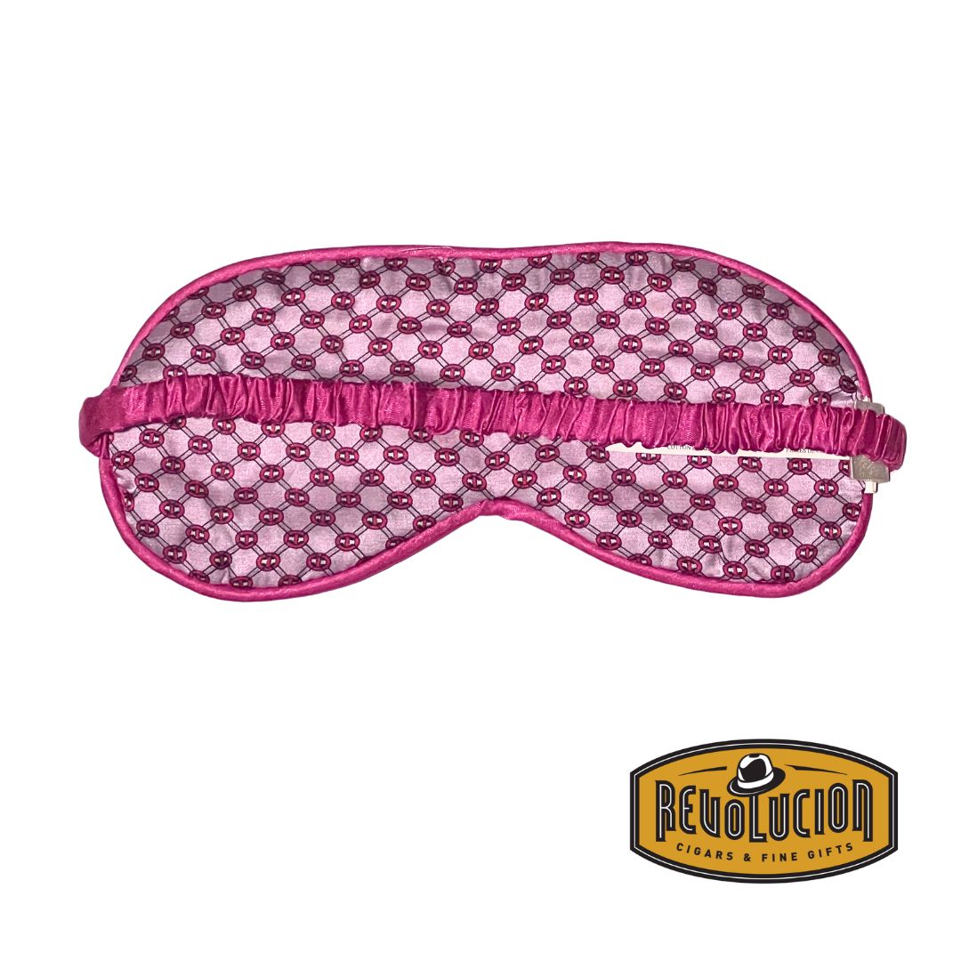 A smooth pink sleep mask made from gentle fabric, ensuring comfort and total darkness for a restful sleep experience.