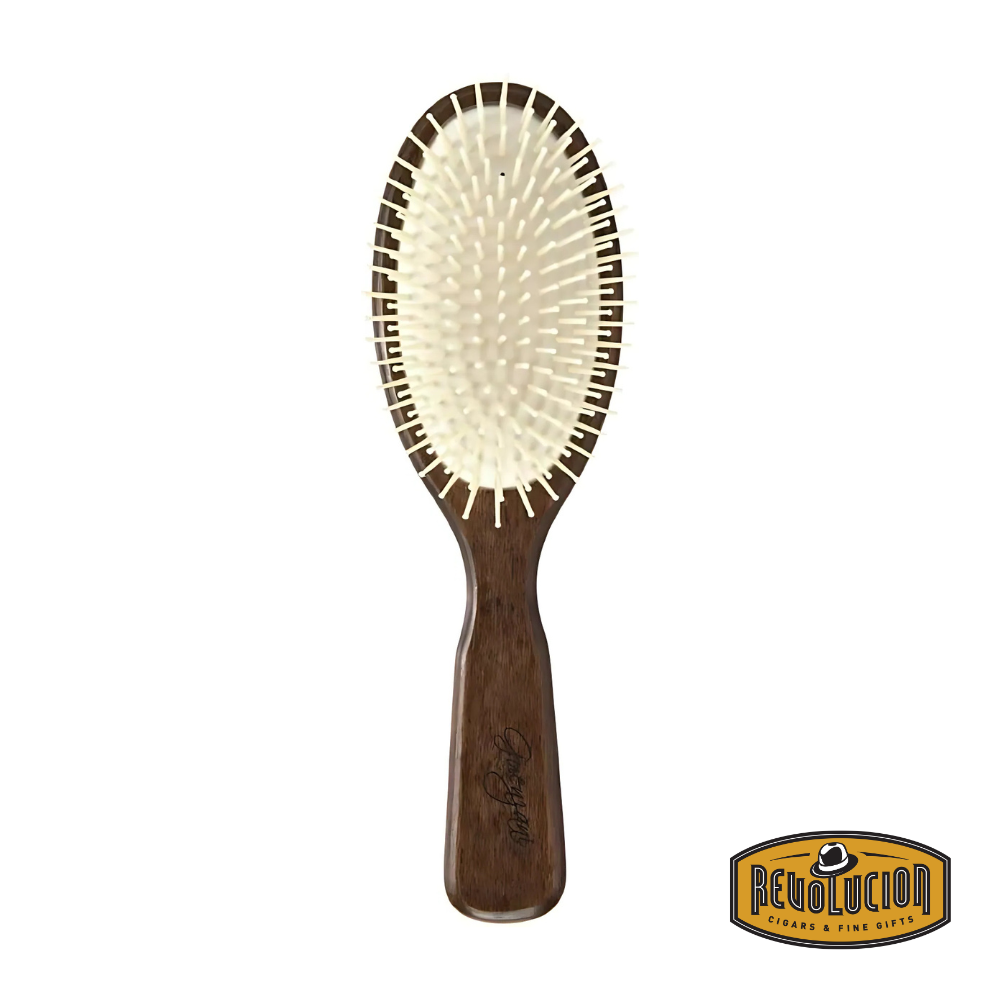 Guenzani Brosse En Bois brush with metal-tipped bristles and a polished wooden handle, designed for smooth and efficient hair detangling.