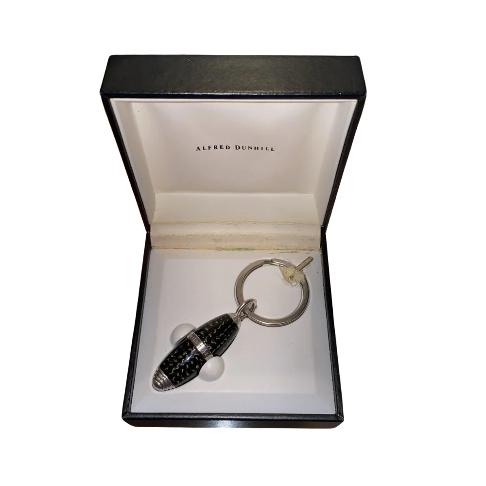 Dunhill Keychain Utility – a sleek, multi-functional luxury accessory featuring premium metal craftsmanship and elegant design.