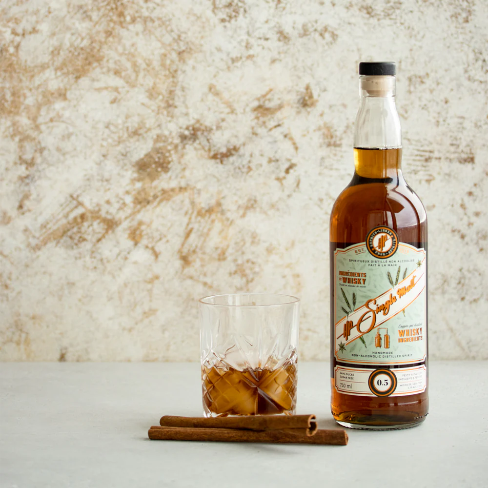 HP Single Malt Whisky 750 mL non-alcoholic spirit bottle next to a filled whisky glass, showcasing a classic drinking experience without alcohol.