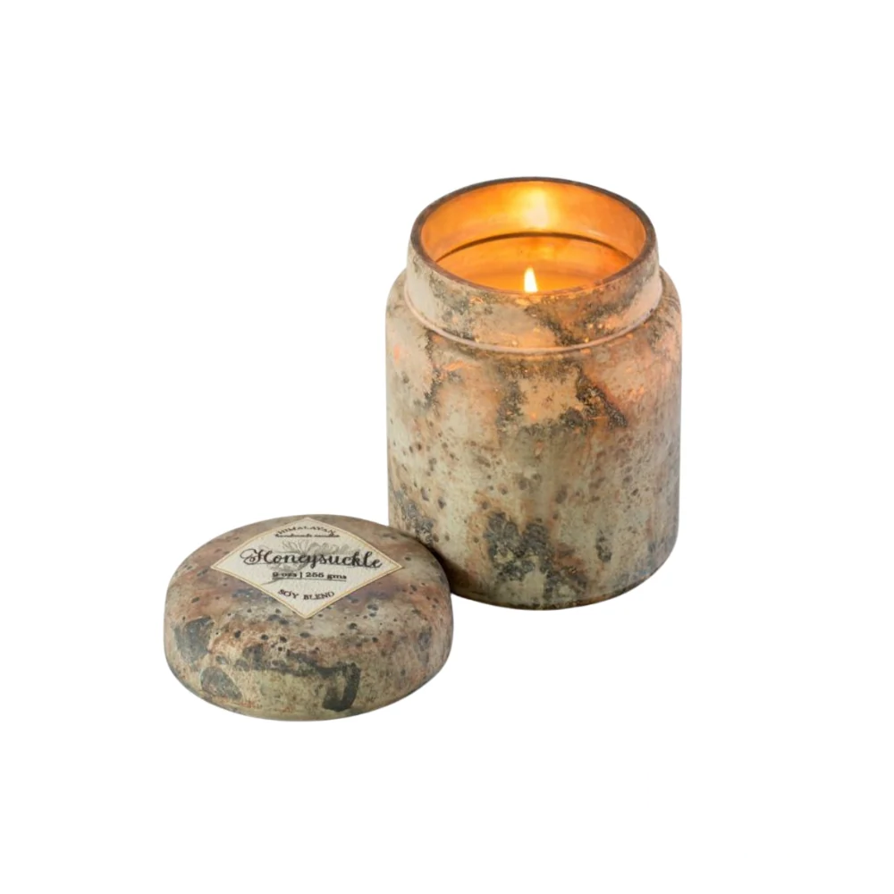 Himalayan Smoke Mountain Fire Glass Lidded Candle – 9oz candle in a sophisticated glass jar, filled with the sweet and floral essence of honeysuckle.