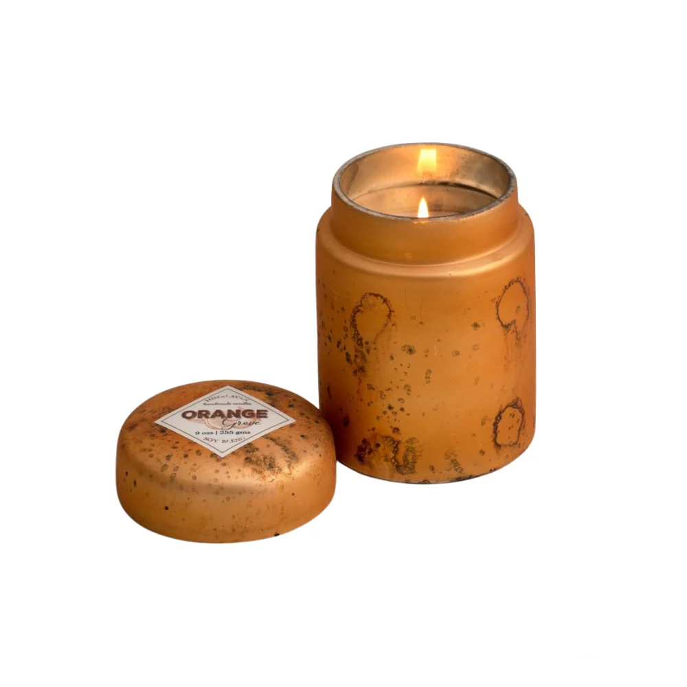 Himalayan Smoke Mountain Fire Glass Lidded Candle – 9oz candle presented in a refined glass jar, capturing the fresh and citrusy fragrance of an orange grove.