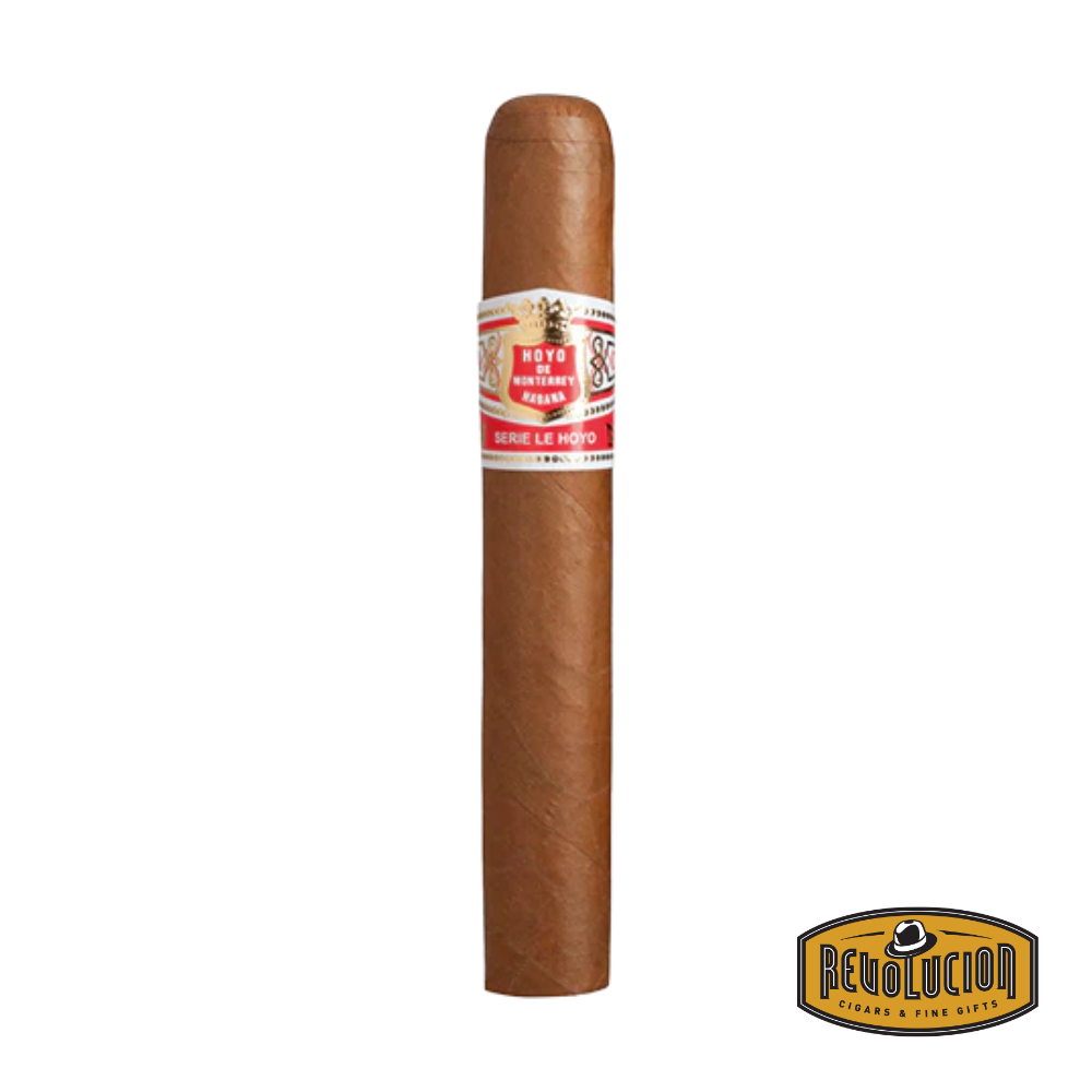 Hoyo de Monterrey San Juan Toro Cuban cigar on a white background with the Revolucion logo, showcasing a medium strength profile and refined red-and-gold band.