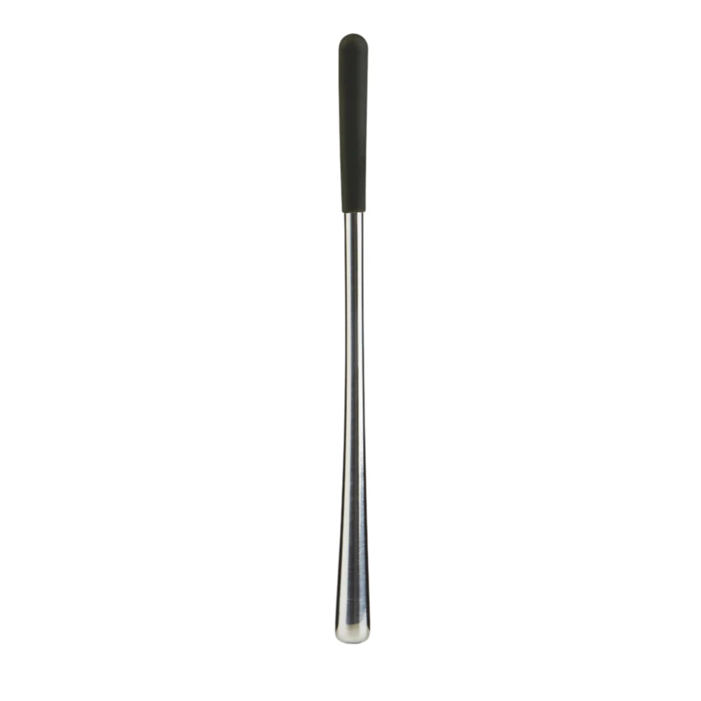 Icy Stainless Steel Swizzle Stick placed on a clean surface, showcasing its sleek and modern design.