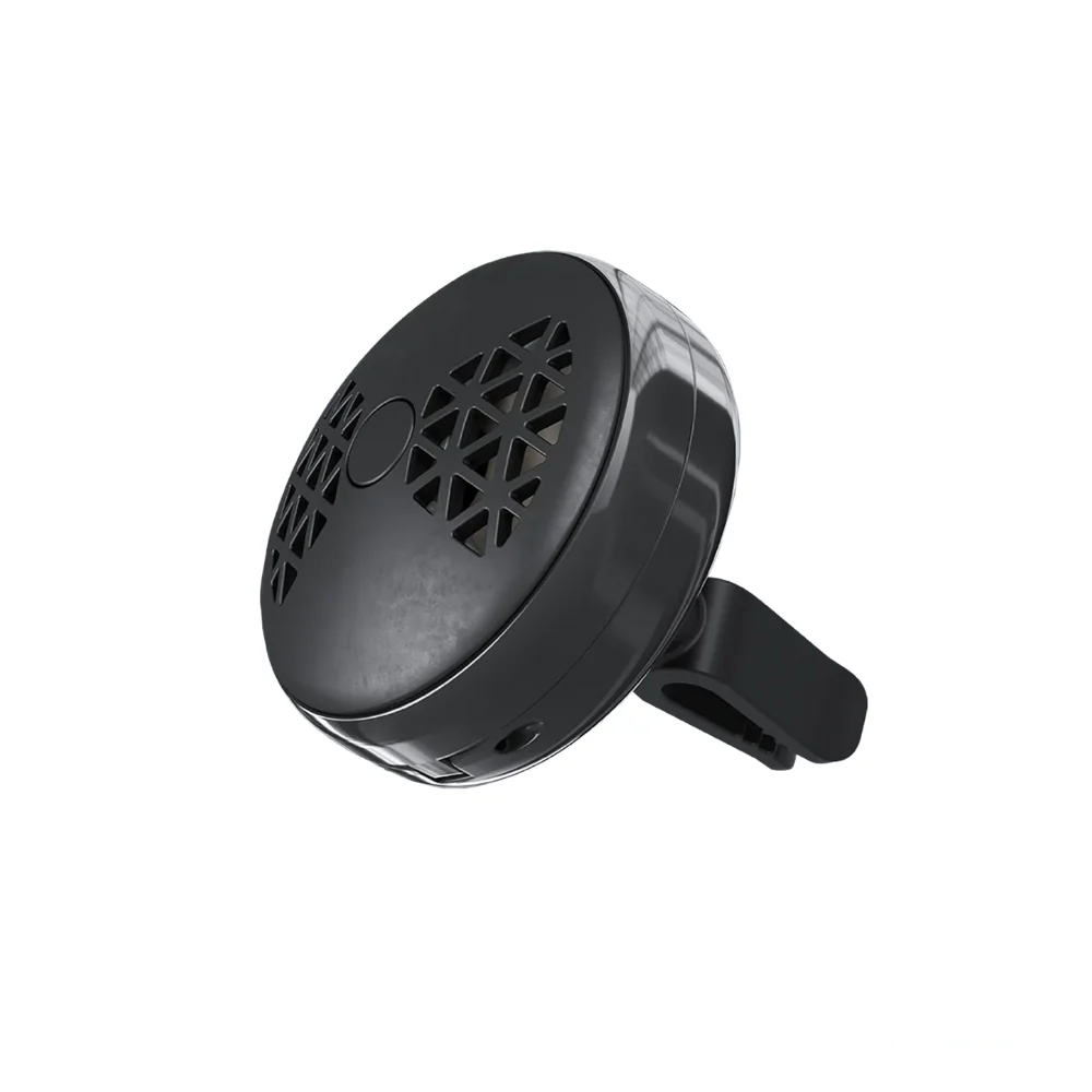 The photo shows the side of the Maison Berger Smart Car Diffuser, featuring a smooth and streamlined design in tones of black and gunmetal. The device has a small knob on the side that can be turned to adjust the fragrance intensity.