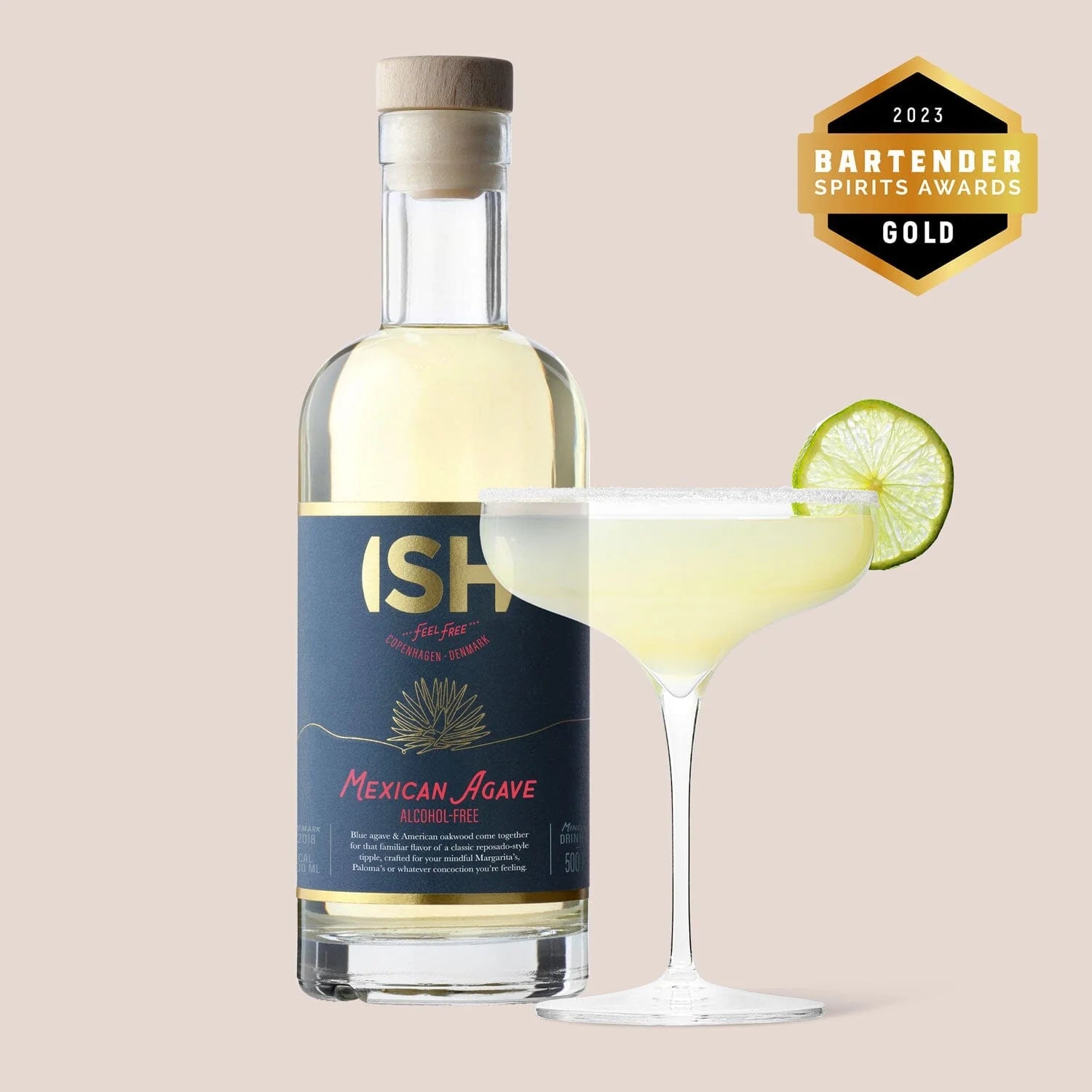 A 500 ml bottle of ISH Mexican Agave Tequila beside a cup filled with a mocktail made using the agave spirit, providing a refreshing, alcohol-free twist on classic tequila drinks.