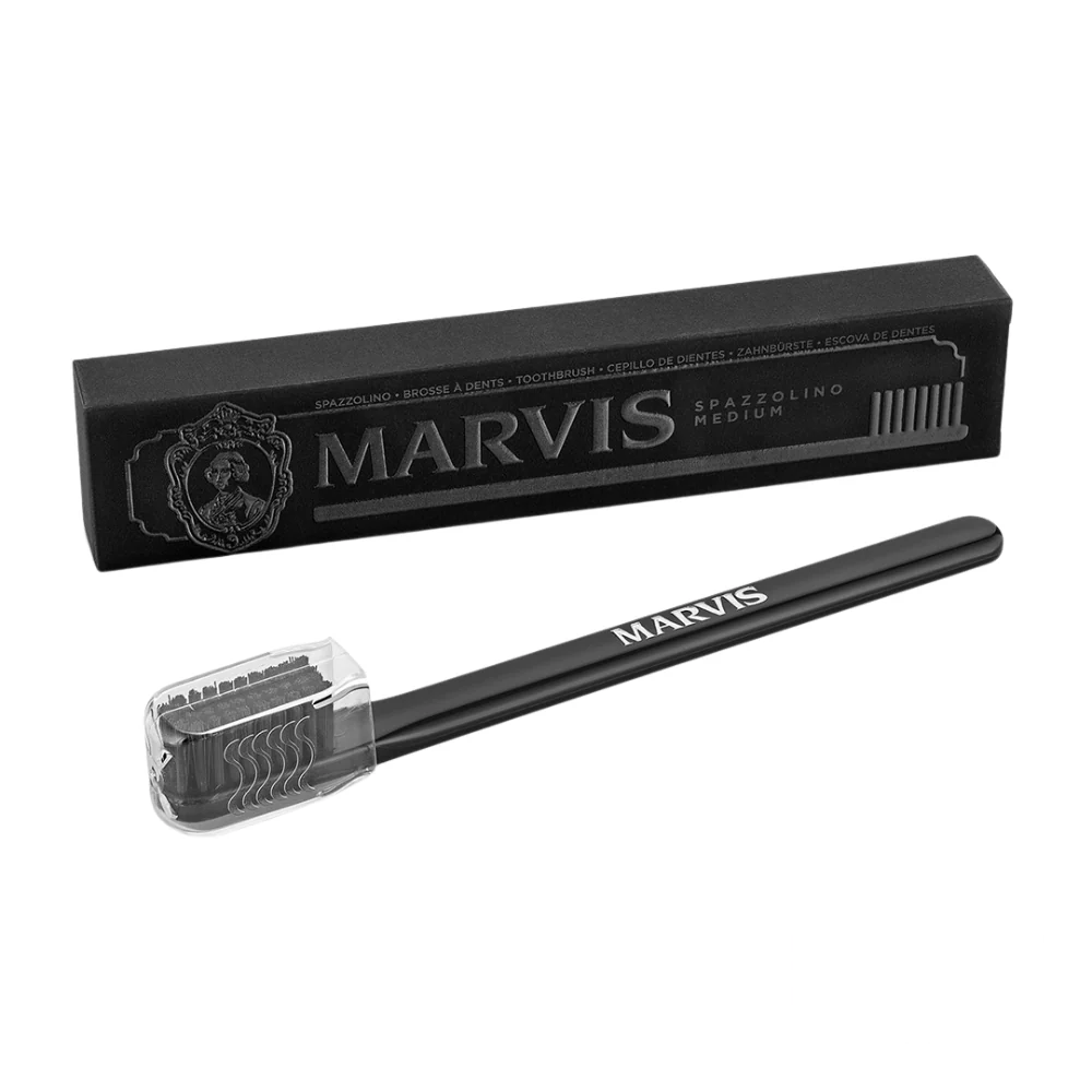 Marvis Toothbrush Black Medium – sleek black toothbrush with a minimalist, classic design and medium bristles, presented against a clean background.