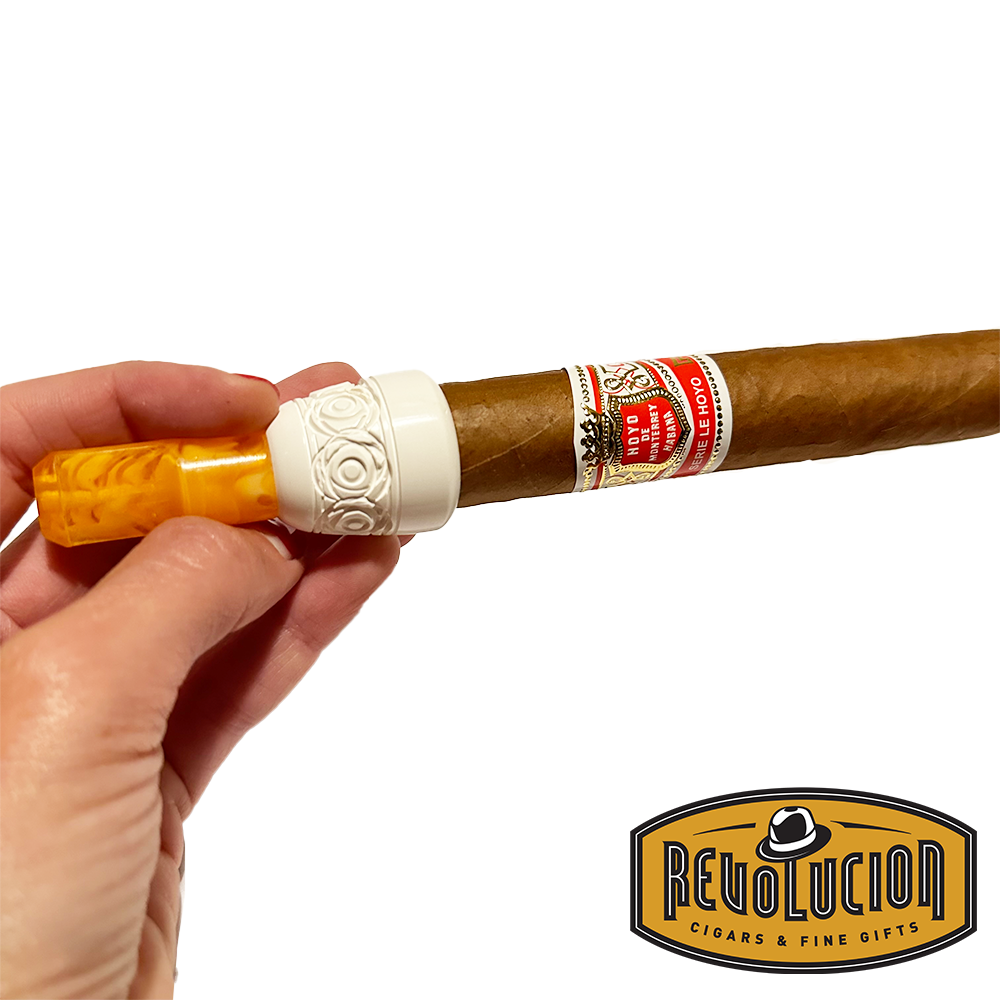 Compact Meerschaum cigar holder with a cigar, highlighting its smooth design and excellent craftsmanship.