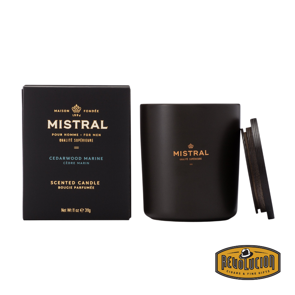 Mistral Cedarwood Marine Scented Candle – A premium 11oz candle blending the fresh, invigorating essence of marine notes with the warm, grounding aroma of cedarwood. Encased in a sleek matte black jar with gold accents and a sophisticated wooden lid.