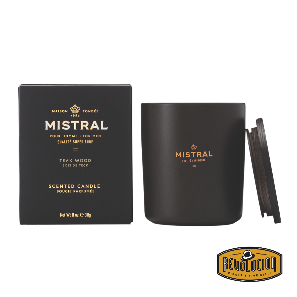 Mistral Teak Wood Scented Candle – A luxurious 11oz candle featuring a deep, rich teak wood aroma with warm, earthy undertones. Housed in a sleek matte black jar with gold accents and a stylish wooden lid.