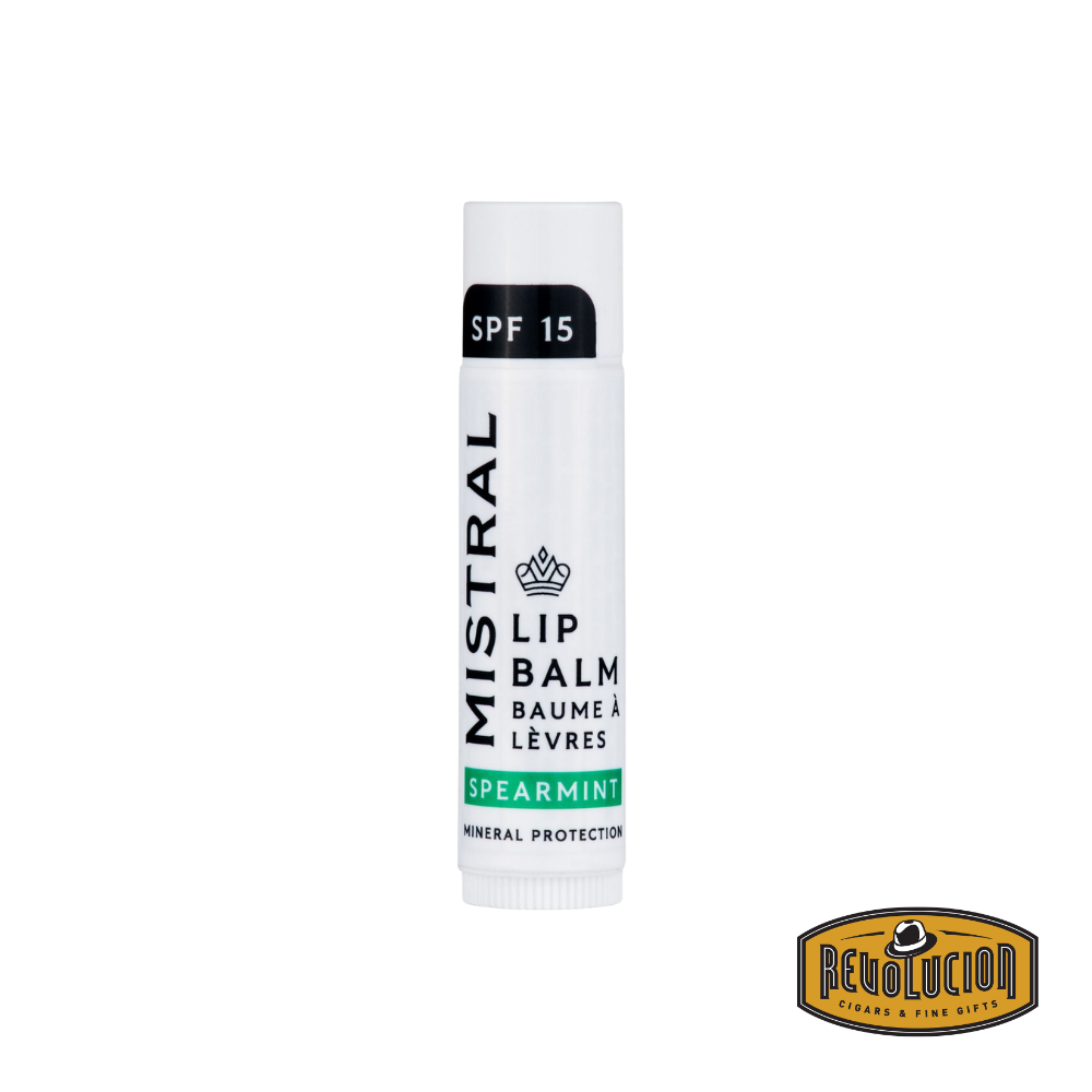 Mistral Lip Balm SPF 15 - Spearmint – a sleek, minimalist tube in white and green, offering lip protection with a refreshing spearmint flavor.