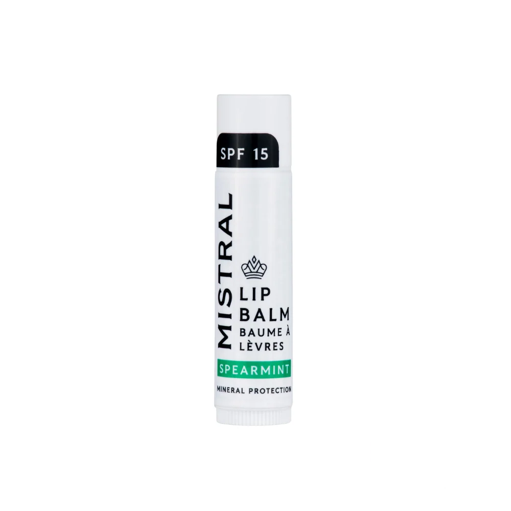 Mistral Lip Balm SPF 15 - Spearmint – a sleek, minimalist tube in white and green, offering lip protection with a refreshing spearmint flavor.