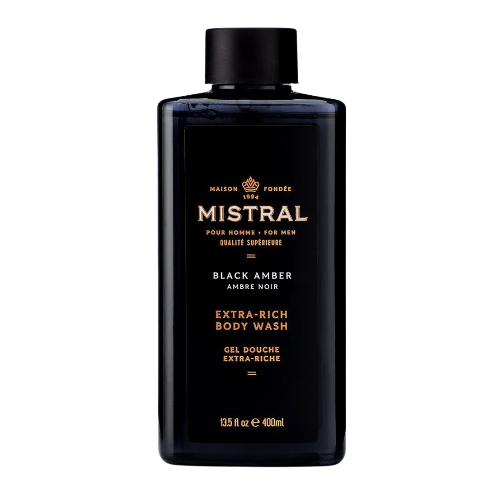 Mistral Men's Extra Rich Body & Hair Wash in Black Amber scent, featuring a dark, moody bottle with gold details and an aura of deep sophistication.
