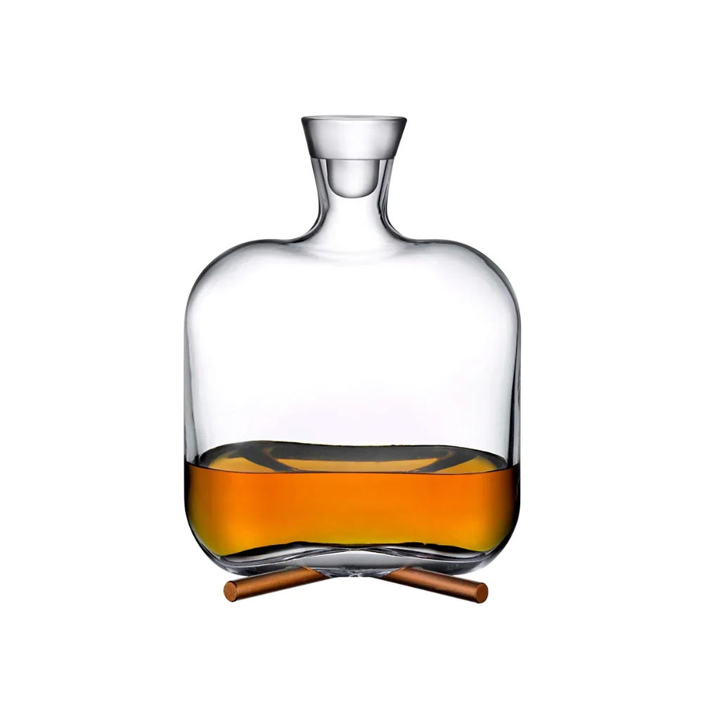 Nude Camp Whiskey Carafe filled with rich amber liquid, showcasing its elegant and minimalist glass design, perfect for serving and storing whiskey in style.