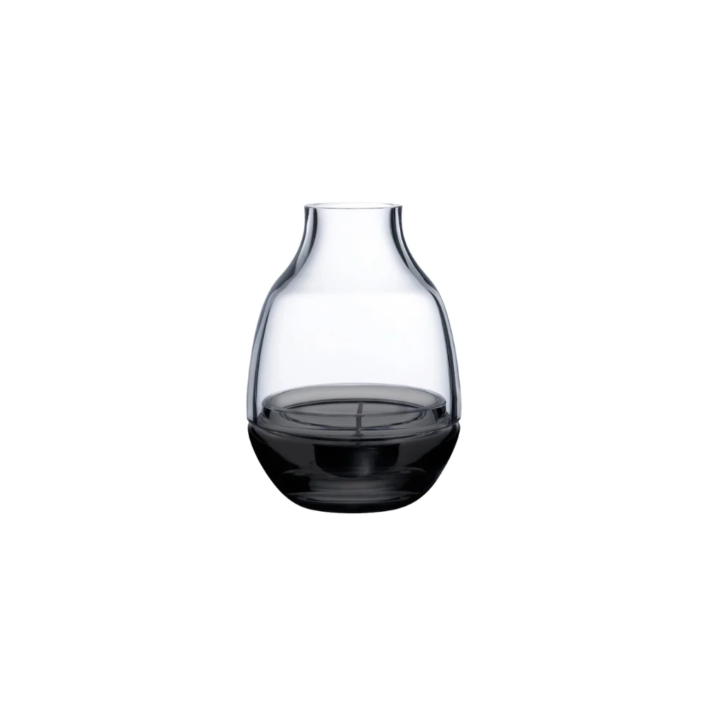 Nude Eden Smoke Candle Holder featuring a sleek, minimalist glass design with a smoky finish, perfect for modern décor.