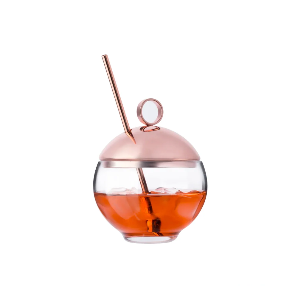 Nude Hepburn Alchemy Glass, filled with liquid, showcasing its sophisticated design and ability to enhance the drinking experience.