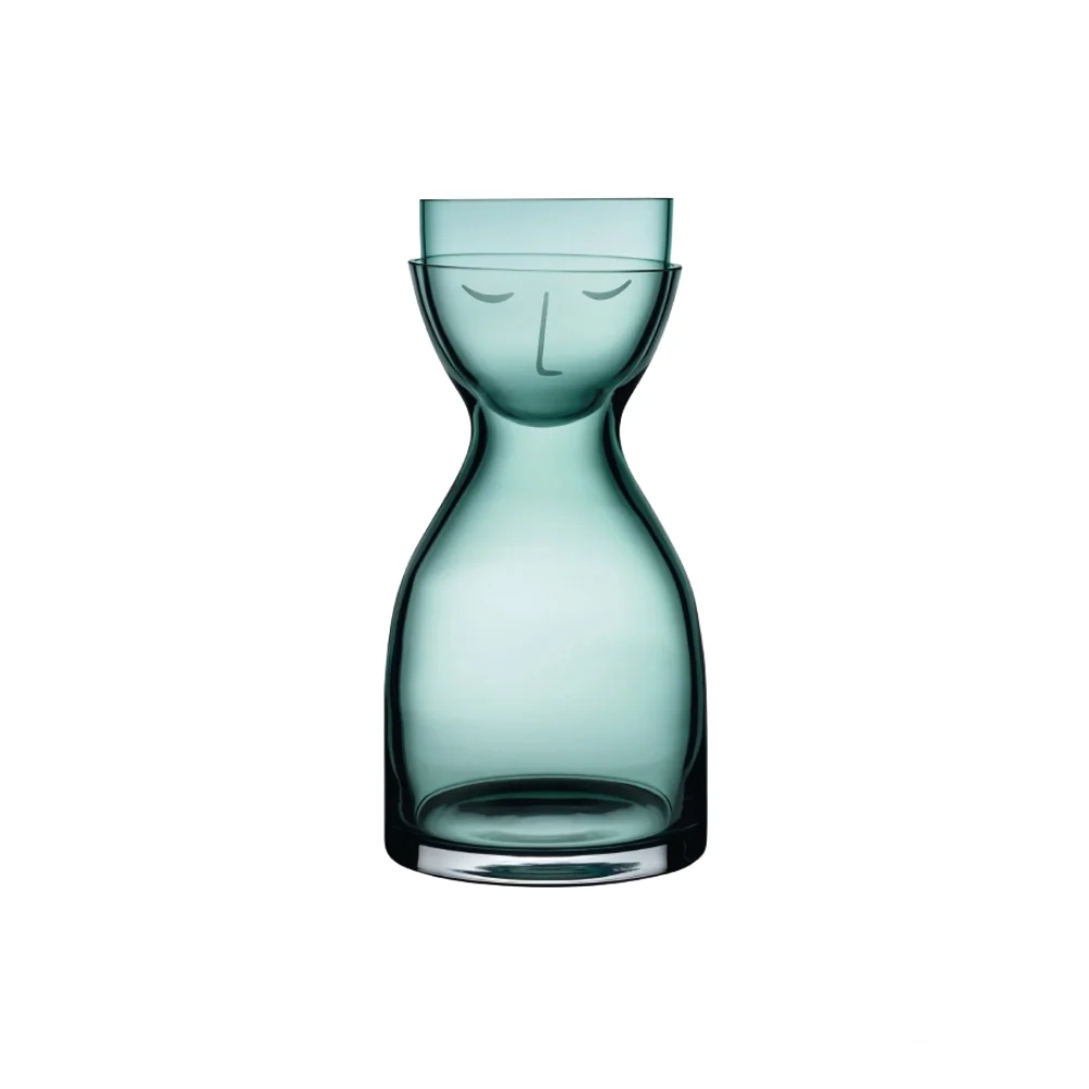 Nude Mr. & Mrs. Night Set in green, featuring a beautifully designed bottle with a modern and elegant silhouette, perfect for enhancing any drink presentation.