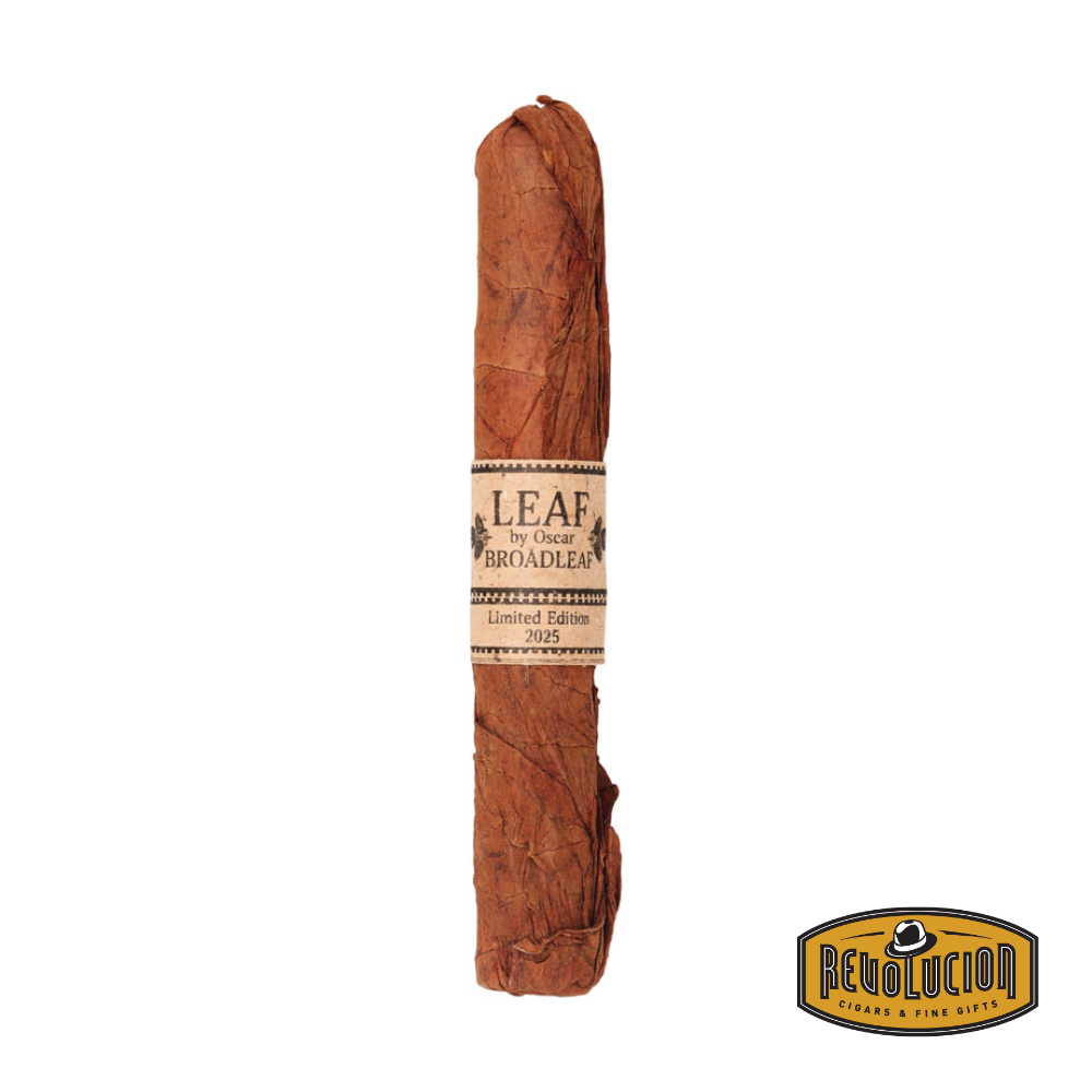 Oscar Valladares Leaf by Oscar Broadleaf Limited Edition Toro cigar wrapped in a natural tobacco leaf with a dark, oily broadleaf wrapper beneath.