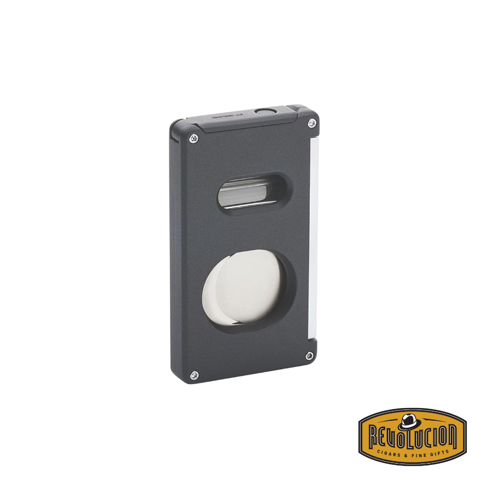 A stylish grey Porsche Design 3-in-1 Cutter with a sleek metallic finish and compact ergonomic design for premium cigar cutting.