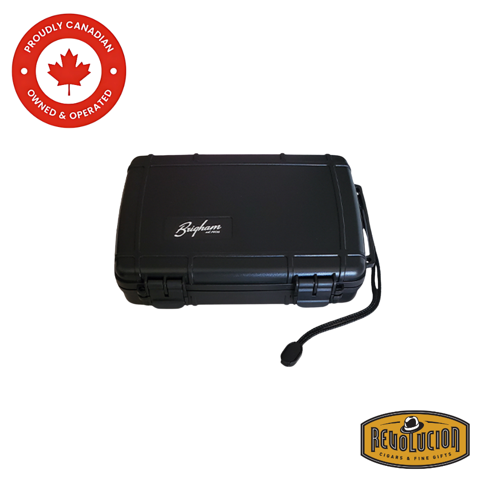 Revolucion Travel Humidor 7 Count, a compact and rugged black humidor designed for ultimate cigar protection during travel.