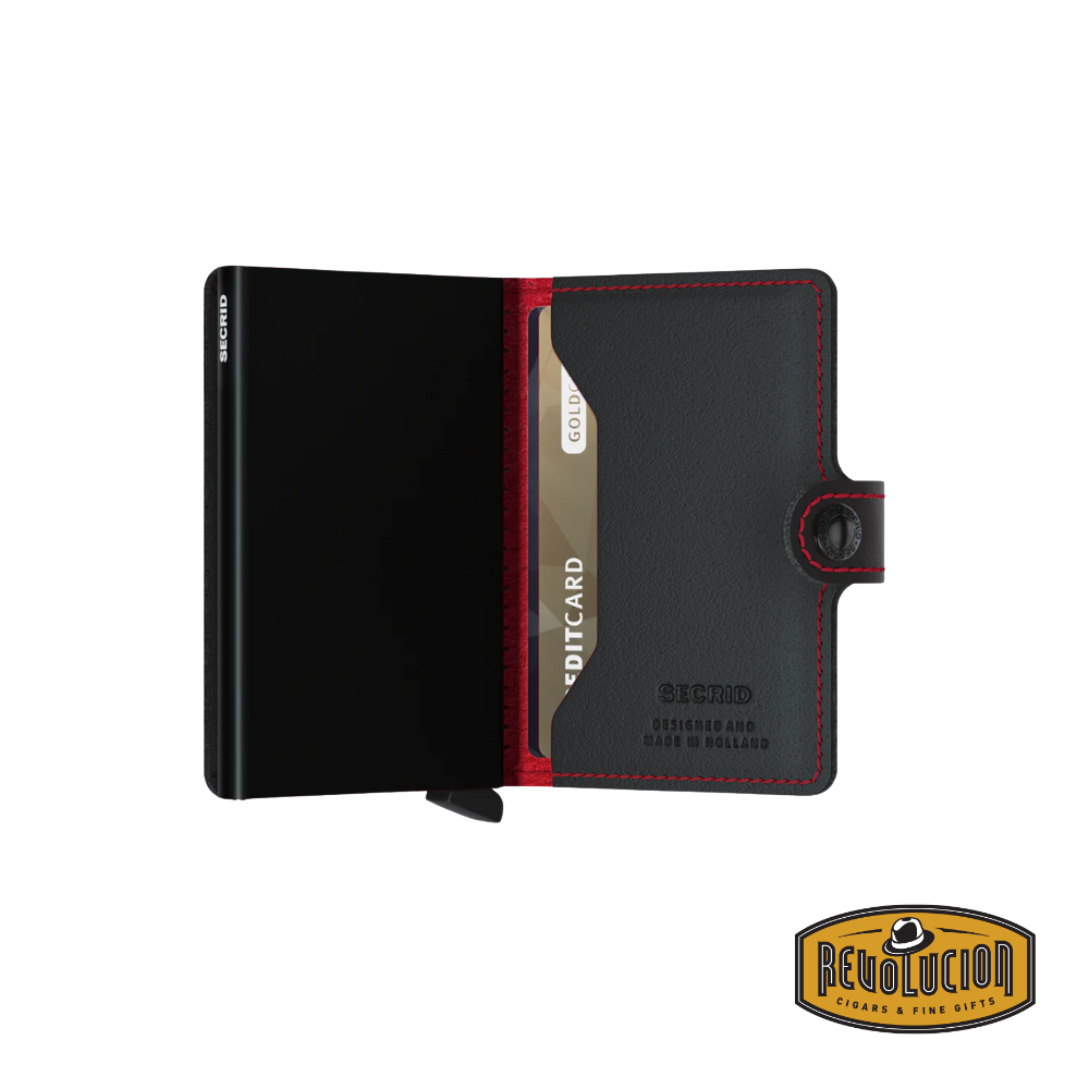 The Secrid Miniwallet in Perforated Black Red, partially opened, revealing its RFID-blocking aluminum cardholder and elegant red leather interior.
