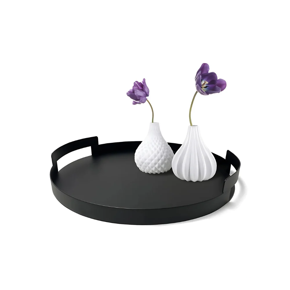 Black metal serving tray with decorative flowers, styled for display or home decor inspiration.