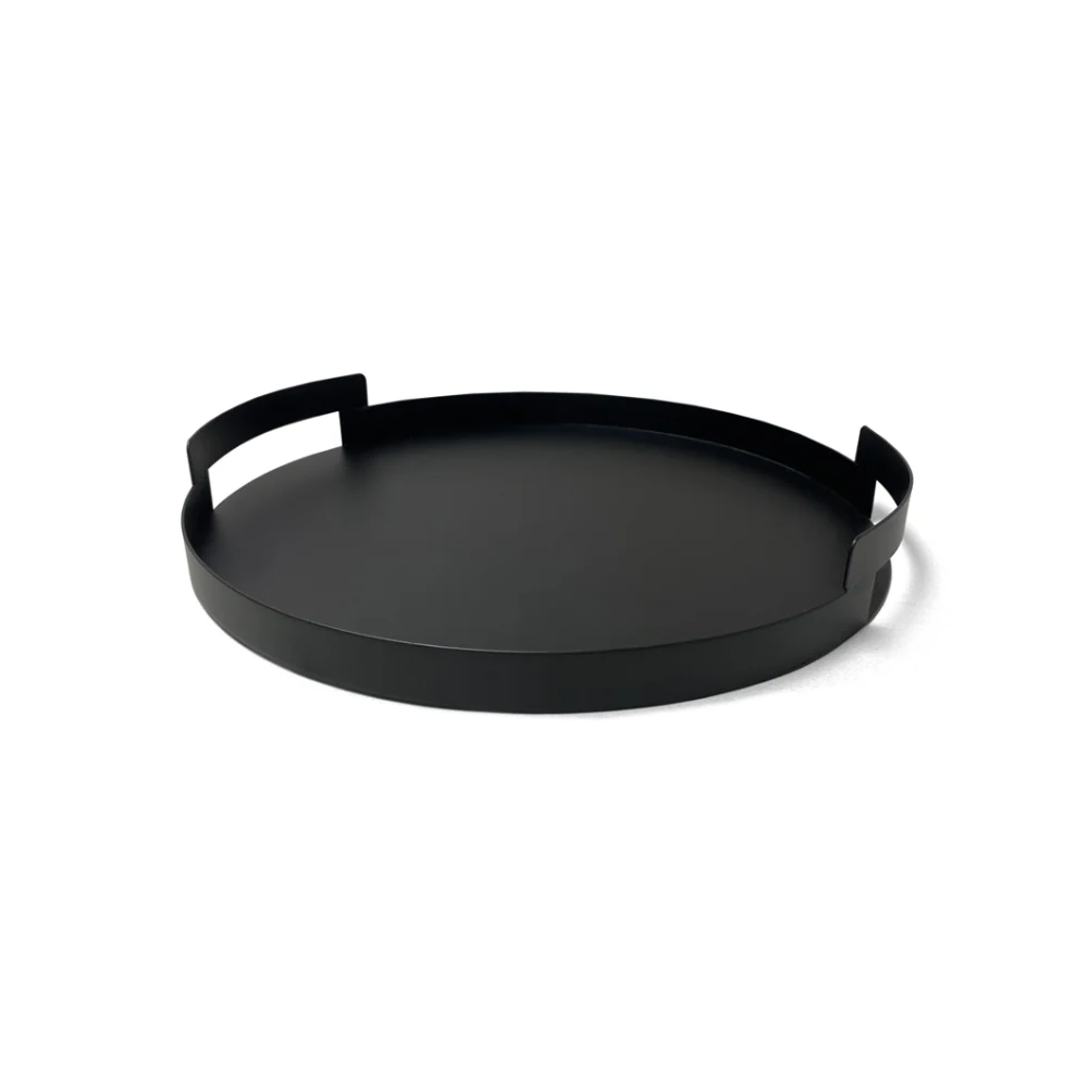 Minimalist black metal serving tray with sleek edges, empty on a neutral surface.