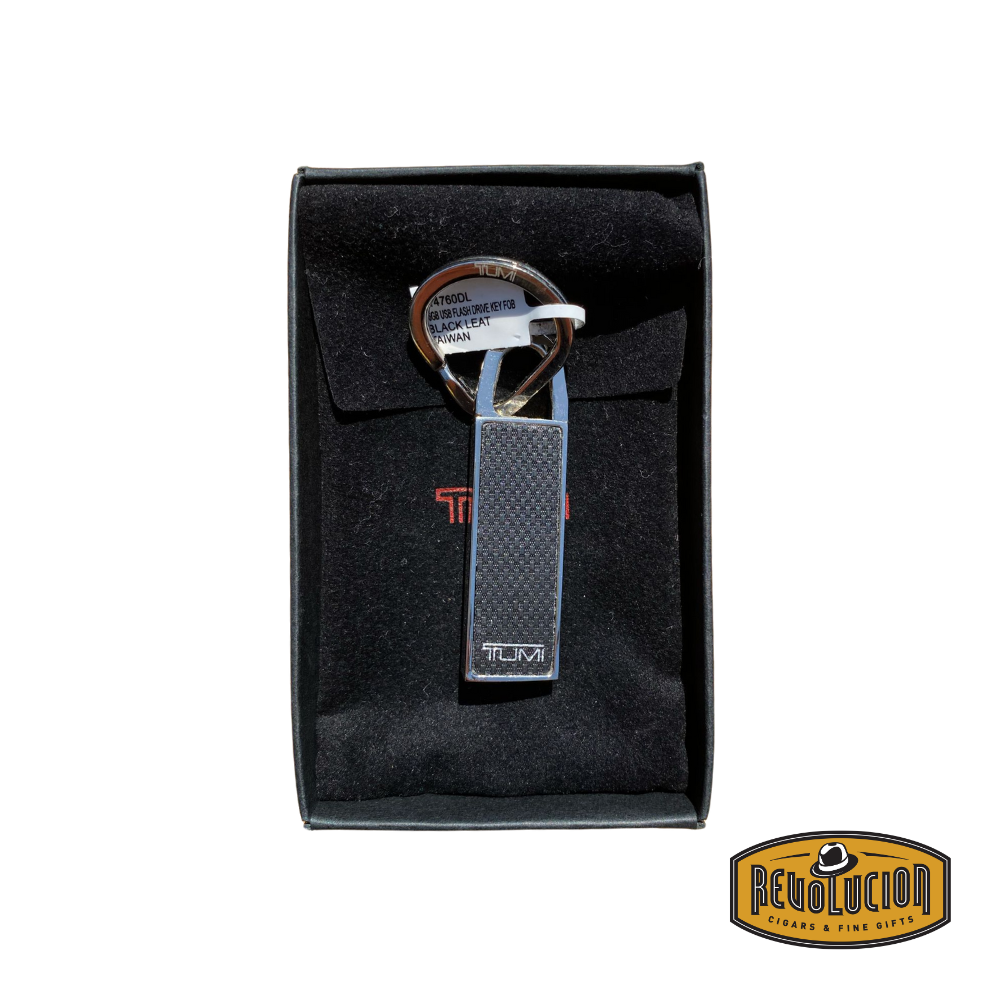 Opened box showing Tumi 16GB USB flash drive key fob.