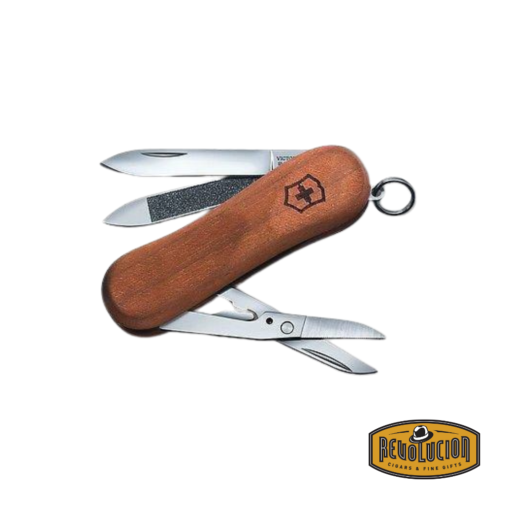 Victorinox Evowood 81 Walnut pocket knife, featuring a beautifully crafted walnut wood handle, with an open blade, nail file, and scissors, showcasing its Swiss precision and elegance.